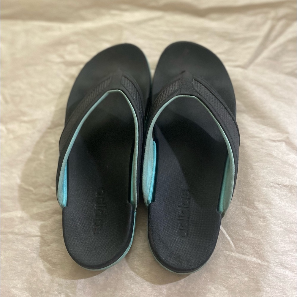 Blue and black adidas sandals